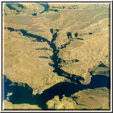 views of deserts and Rocky Mountains from a plane