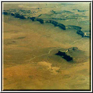 views of deserts and Rocky Mountains from a plane