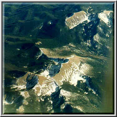 views of deserts and Rocky Mountains from a plane