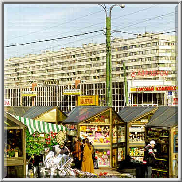 Rows of merchandising kiosks surrounding subway ...[6 words]... St. Petersburg, Russia, April 13, 1999.