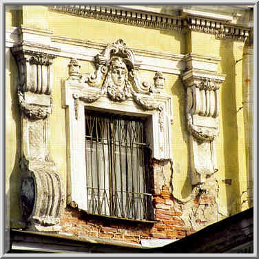 Decaying plaster on a building facing Fontanka ...[5 words]... St. Petersburg, Russia, April 13, 1999.