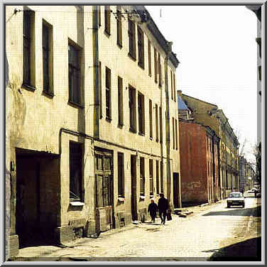 Repin Street on Vasilyevsky Island paved by cobble-stones. St. Petersburg, Russia, April 14, 1999.