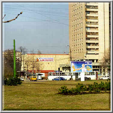 Muzhestvo Square with post-Soviet advertisements ...[16 words]... St. Petersburg, Russia, April 19, 1999.