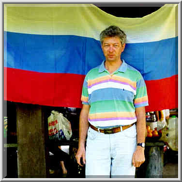 A. Sergeev in front of a new tri-color Russian ...[7 words]... near Lafayette, Indiana, May 9, 1999.