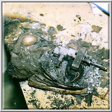 Remains of a fan (?) and books after a fire in ...[10 words]... West Lafayette, Indiana, June 1, 1999.