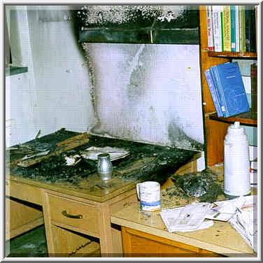 A burned desk in the theoretical chemistry lab ...[13 words]... West Lafayette, Indiana, June 1, 1999.