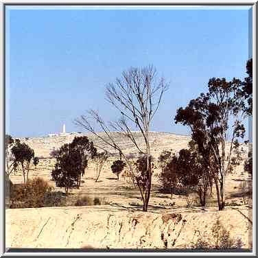 View of the hill with Palmach Memorial from ...[6 words]... foreground. Beer-Sheva, March 4, 2000