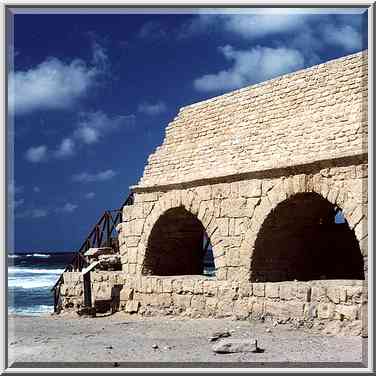 Roman aqueduct in Caesaria on the beach of Mediterranean Sea. The Middle East, April 22, 2000