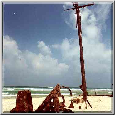 Shipwreck on a beach near Dor. The Middle East, August 24, 2000