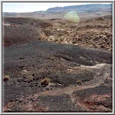 Blackened stones in Ramon Crater. Mitzpe Ramon, the Middle East, February 1, 2001