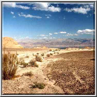 A dry creek going to the rim of a plateau above ...[11 words]... The Middle East, February 22, 2001