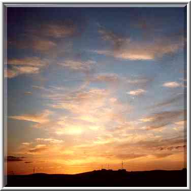 Sunset in northern Beer-Sheva, view from a window ...[2 words]... bus. The Middle East, February 22, 2001