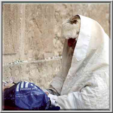 Old City, a worshiper at Western Wall. Jerusalem, the Middle East, March 1, 2001