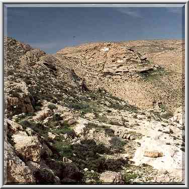 A trail starting from a damn of a polluted water reservoir. Yeroham, the Middle East, March 8, 2001