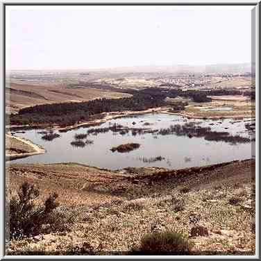 View of a heavily polluted Yeroham reservoir from ...[16 words]... it. The Middle East, March 8, 2001