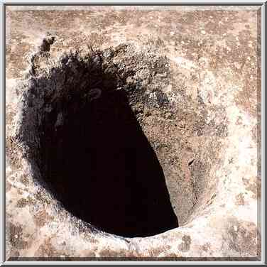 Mysterious hole in a rock on the place of ancient ...[8 words]... ridge. The Middle East, March 8, 2001