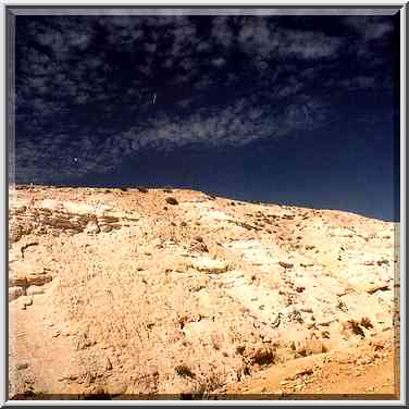 Chalk cliffs behind Yeroham reservoir. The Middle East, March 8, 2001