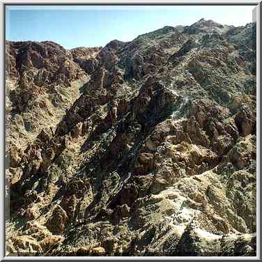 A saddle and a trail to the main summit of Mt. ...[8 words]... Eilat. The Middle East, March 22, 2001