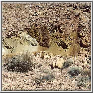 Multicolored sands at the bottom of Ramon Crater, ...[9 words]... Ramon. The Middle East, May 3, 2001