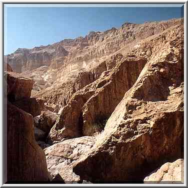 A trail between rocks behind En Namer spring in ...[6 words]... Masada. The Middle East, May 10, 2001