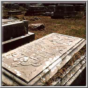 Graves in Christian cemetery south from Tel Akko junction. Akko, the Middle East, June 7, 2001