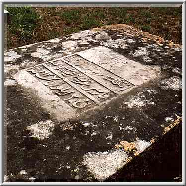 A stone of Christian cemetery south from Tel Akko junction. Akko, the Middle East, June 7, 2001