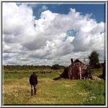 A wooden cabin near World War II soldiers ...[6 words]... from Novgorod. Russia, August 1, 2001