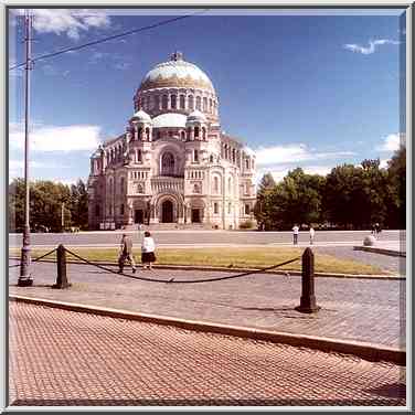 A steel paved road and the maritime cathedral. Kronshtadt, Russia, August 3, 2001