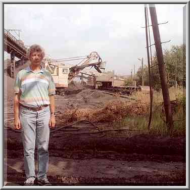 A.S. in front of a coal mining machine at ...[3 words]... south Ural. Russia, August 12, 2001