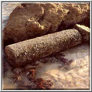 A granite pillar among ruins of ancient harbour ...[10 words]... The Middle East, September 19, 2001