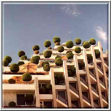 A tall hotel with trees. Eilat, the Middle East, October 13, 2001