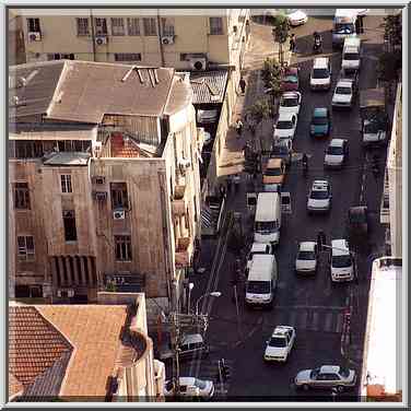 Jamming traffic at Herzl St. at intersection with ...[7 words]... Aviv, the Middle East, October 25, 2001